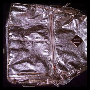 Metallic rose colored backpack purse